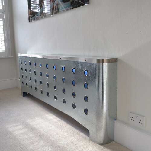 Galvanised radiator covers in ultra modern home with blue lighting