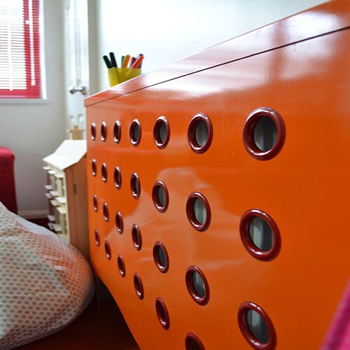 Orange and red radiator cover for childrens nursery for Peter Andre